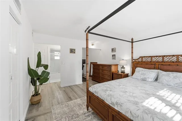 a bedroom with a bed and a dresser