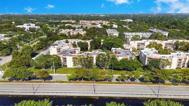 an aerial view of residential houses with city view