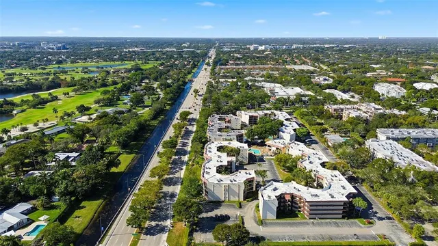 an aerial view of residential houses with outdoor space