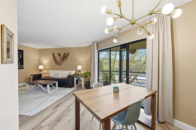 a view of a dining room with furniture window and outside view