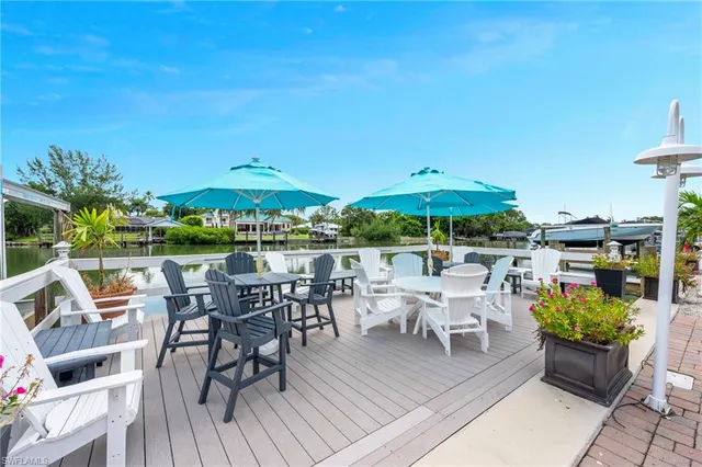 a view of a patio with furniture and a yard
