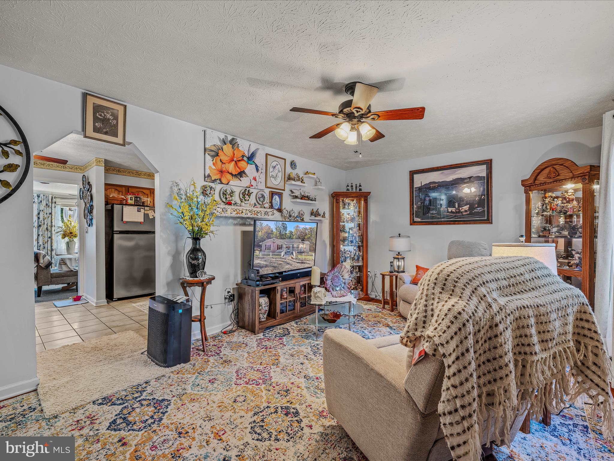 154 Brooklyn's Way Great Cacapon, WV 25422 - Photo 11 of 64 a living room with furniture ceiling fan and a window