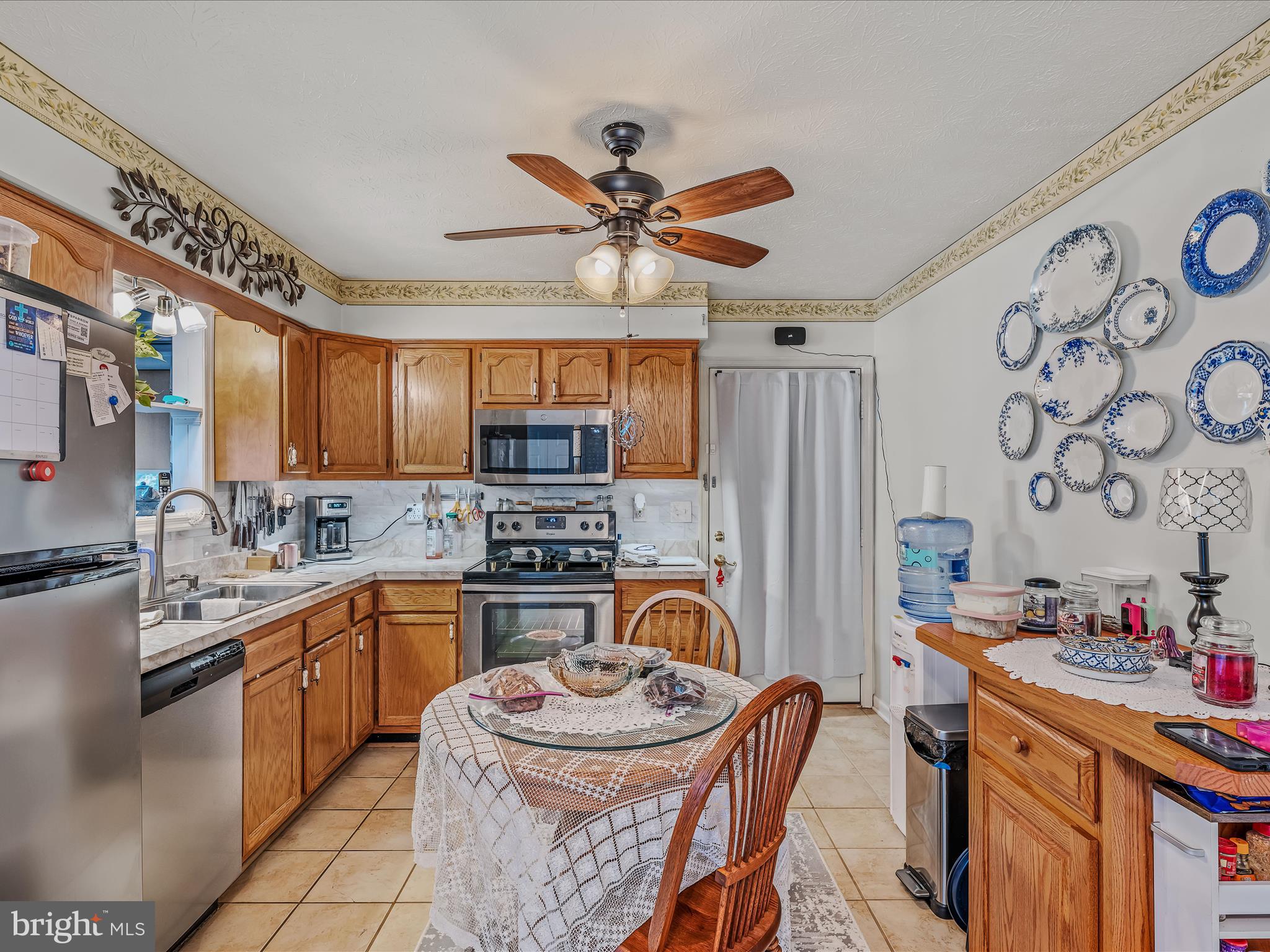 154 Brooklyn's Way Great Cacapon, WV 25422 - Photo 15 of 64 a kitchen with stainless steel appliances granite countertop a sink a stove and a refrigerator