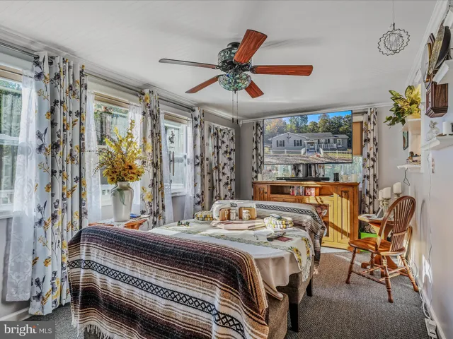 a living room with furniture and a clock