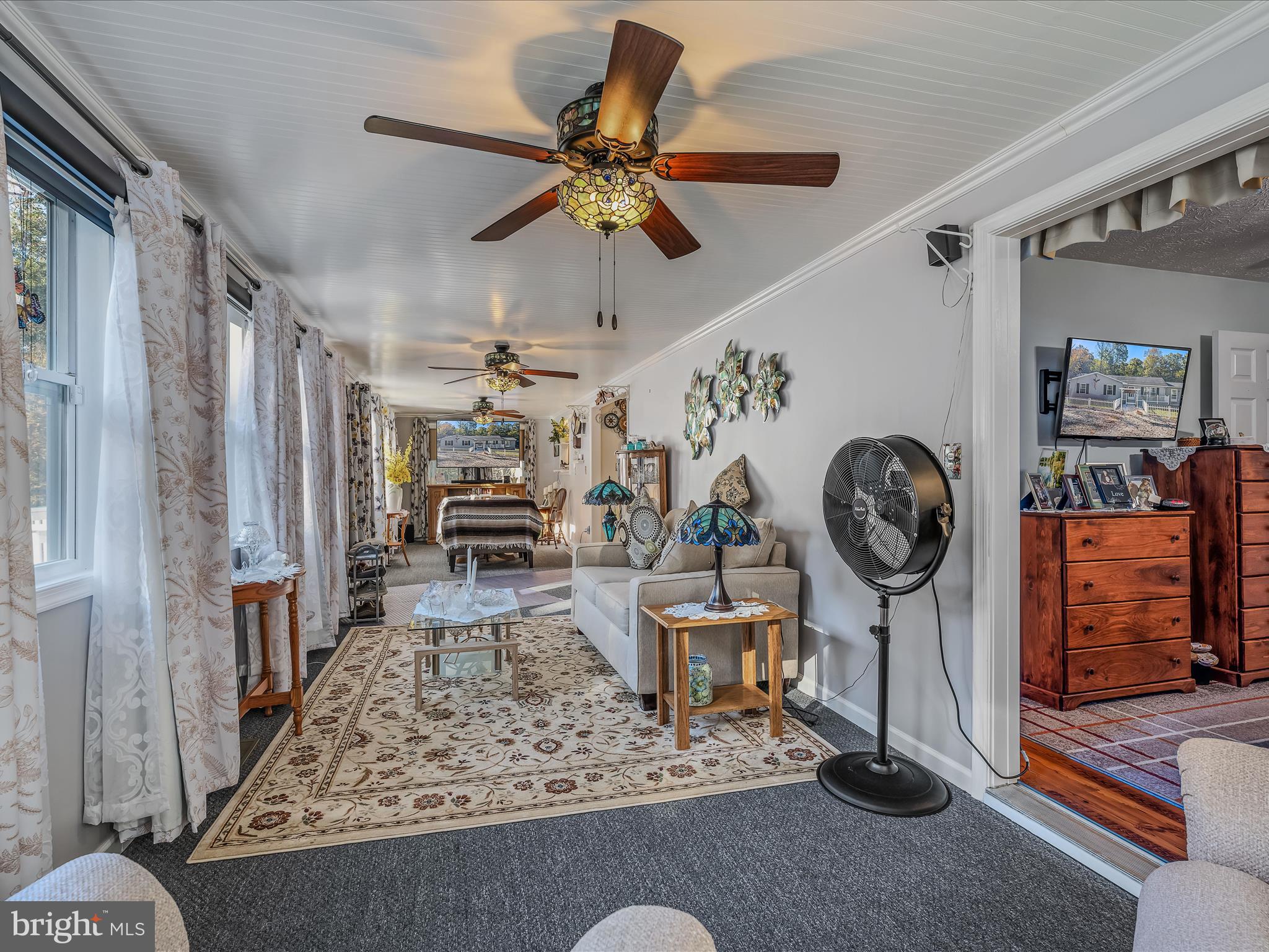 154 Brooklyn's Way Great Cacapon, WV 25422 - Photo 21 of 64 a living room with furniture and a clock