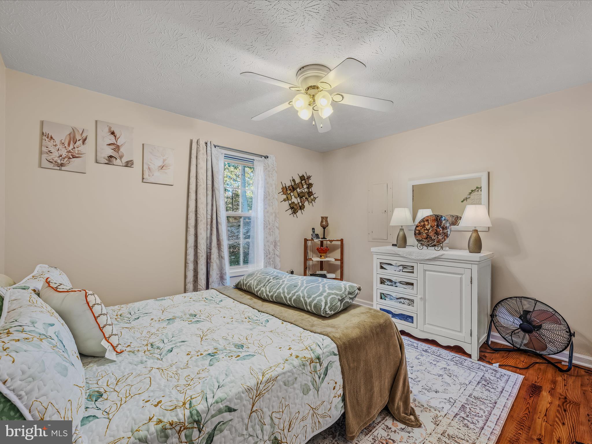 154 Brooklyn's Way Great Cacapon, WV 25422 - Photo 25 of 64 a bedroom with a bed and wooden floor