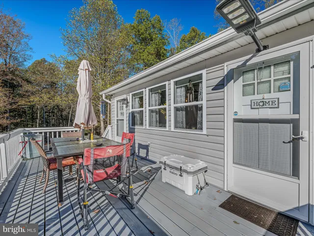 a view of a water fountain and a big tree