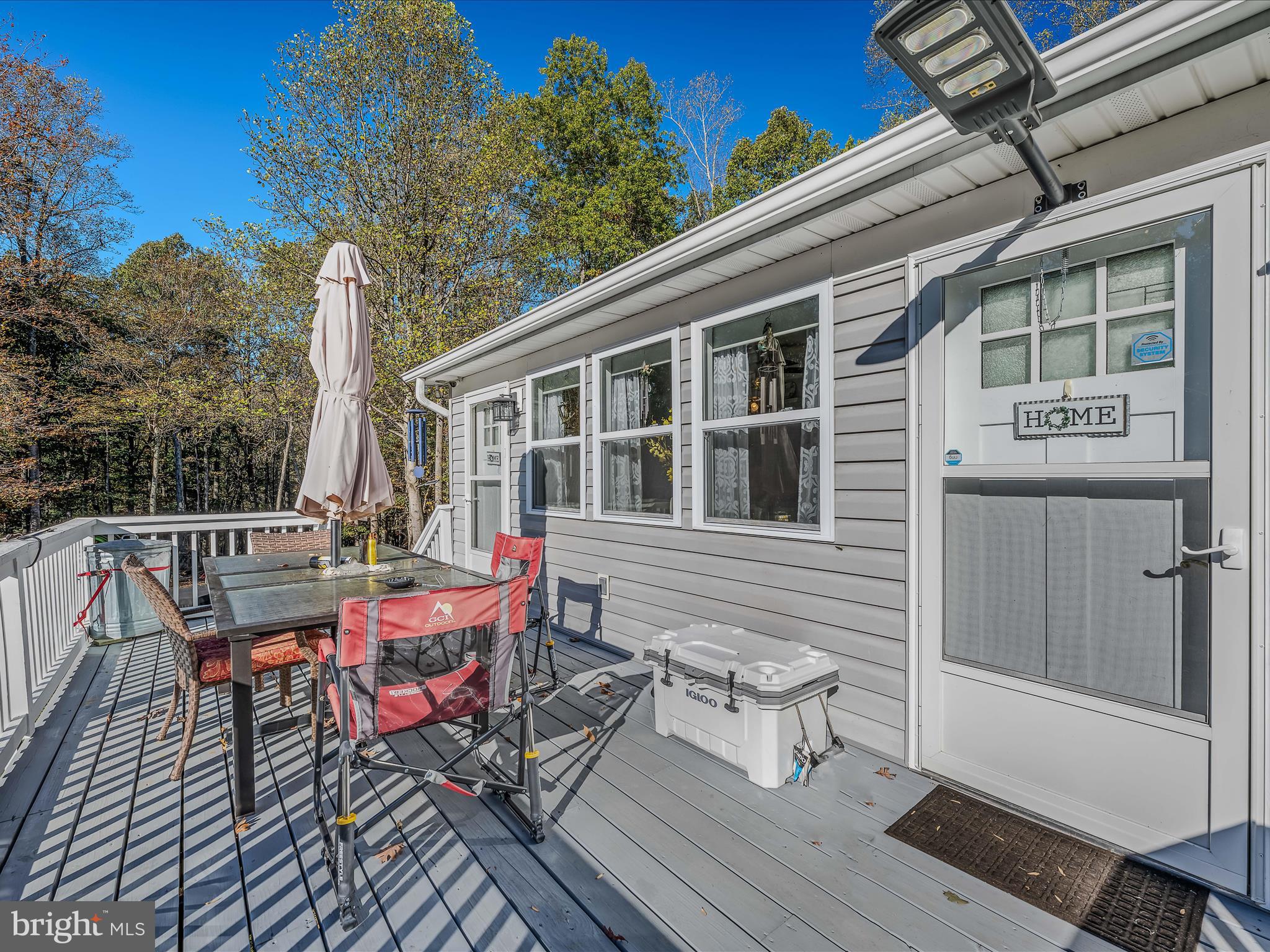 154 Brooklyn's Way Great Cacapon, WV 25422 - Photo 31 of 64 a view of a house with sitting area