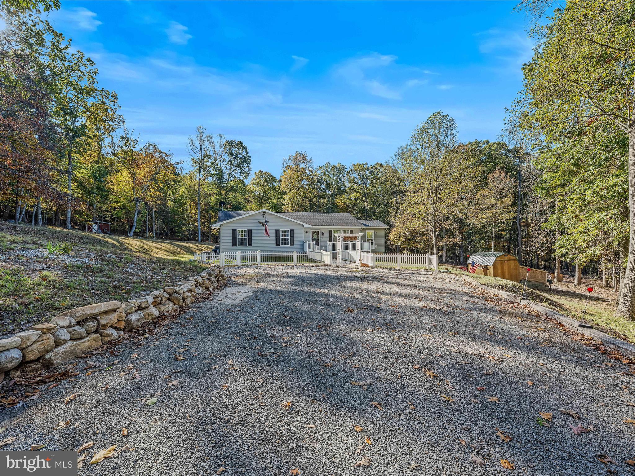 154 Brooklyn's Way Great Cacapon, WV 25422 - Photo 35 of 64 a view of a house with a yard