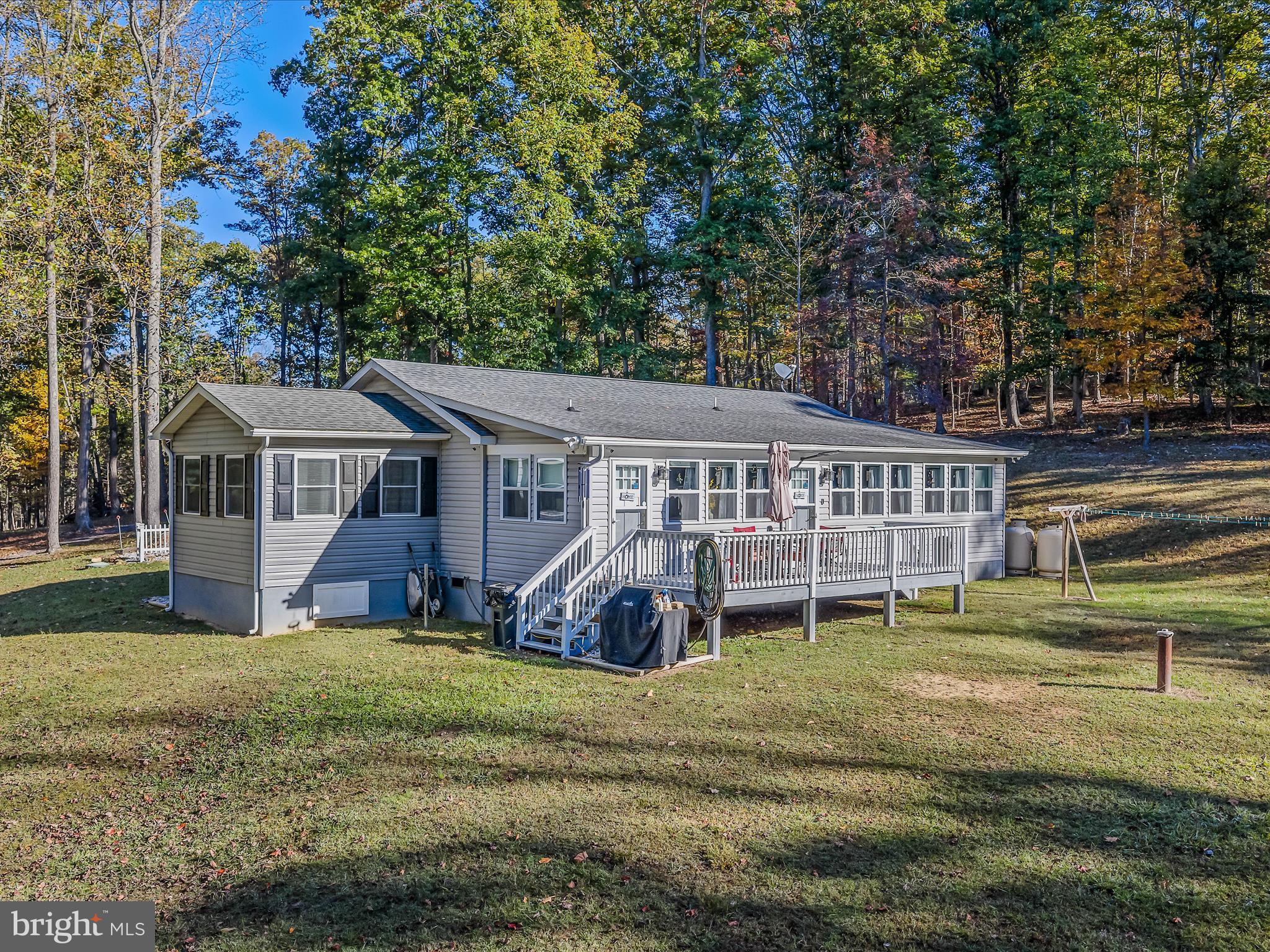 154 Brooklyn's Way Great Cacapon, WV 25422 - Photo 36 of 64 front view of a house with a big yard