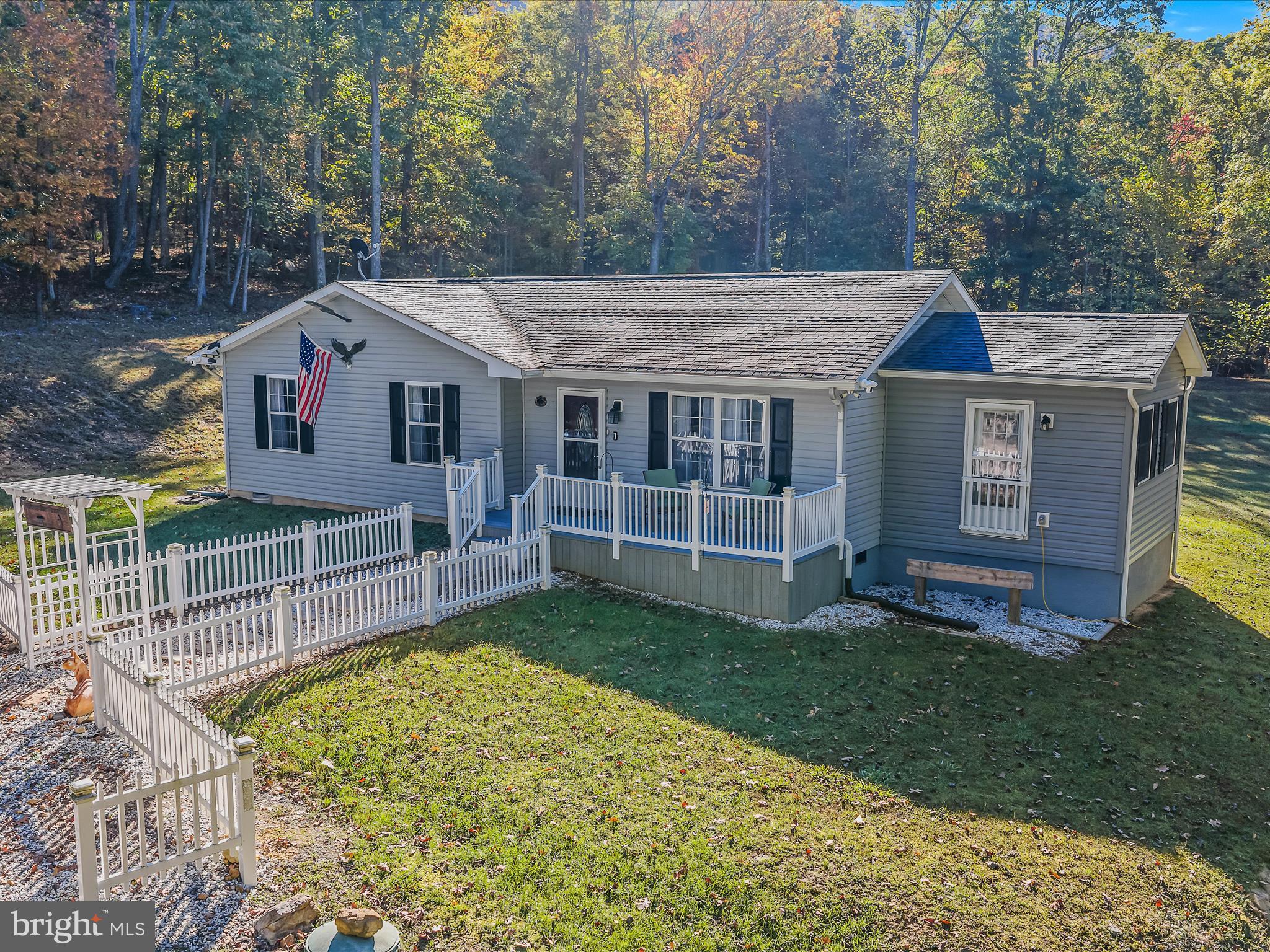 154 Brooklyn's Way Great Cacapon, WV 25422 - Photo 4 of 64 front view of a house with a yard