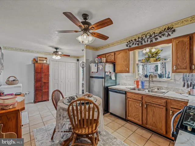 a view of a house with a chairs and wooden floor