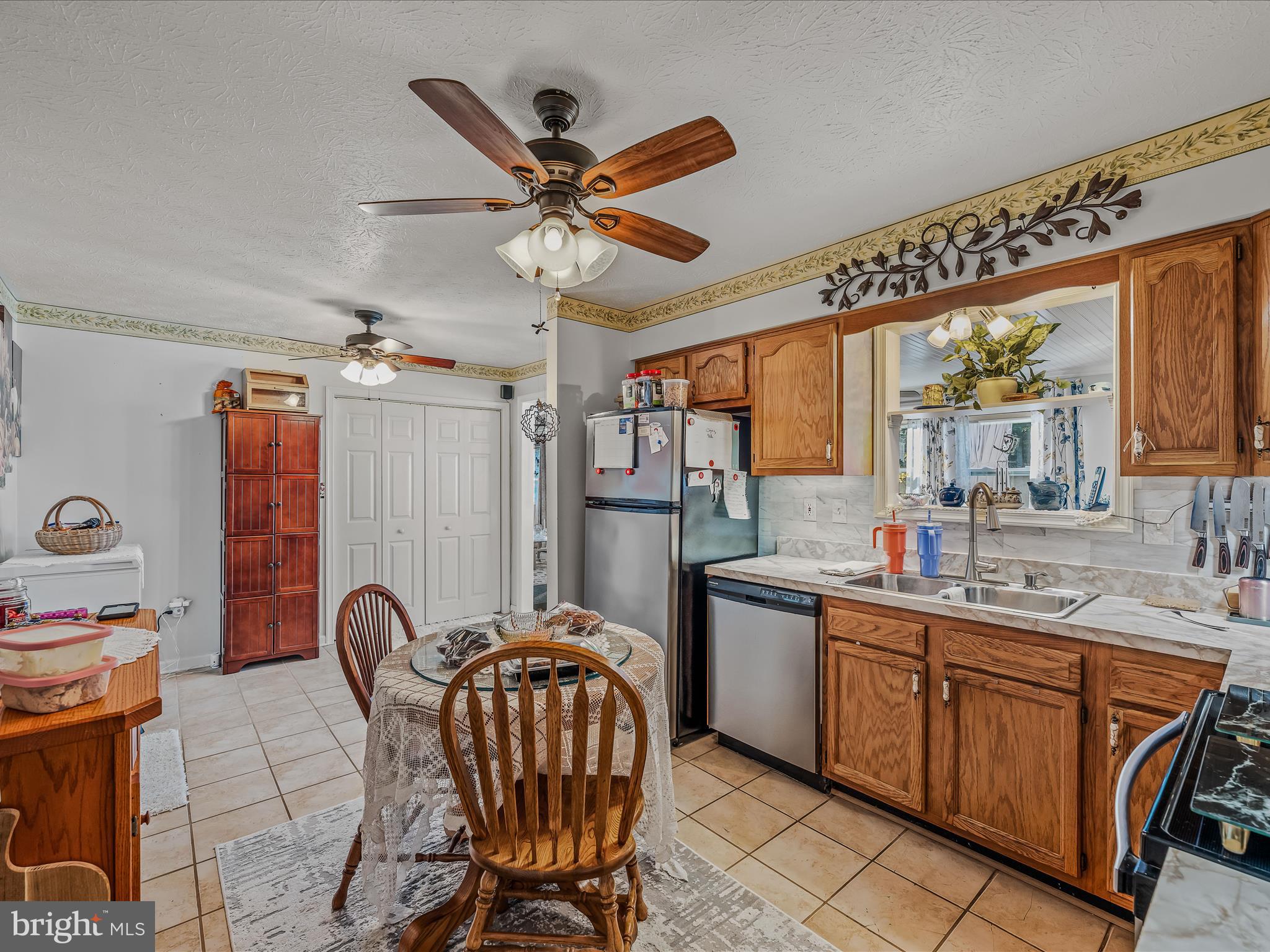 154 Brooklyn's Way Great Cacapon, WV 25422 - Photo 8 of 64 a open kitchen with stainless steel appliances granite countertop a sink a stove and a refrigerator