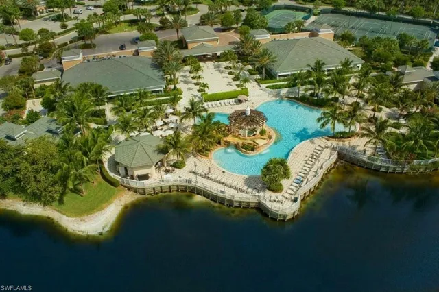 an aerial view of a house with a lake view