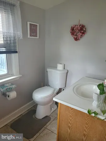 a bathroom with a toilet and a sink