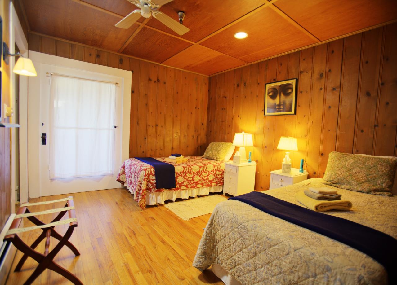 2720 Painted Cave Road Santa Barbara, CA 93105 - Photo 9 of 23 a bedroom with a bed and wooden floor