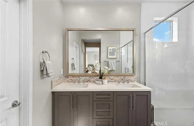 a bathroom with a sink and a mirror