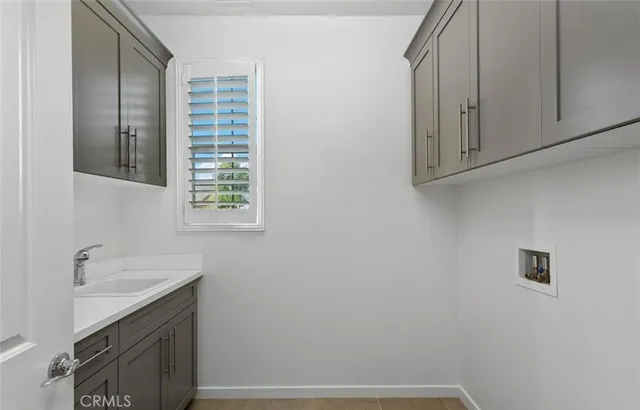 a bathroom with a sink and cabinets