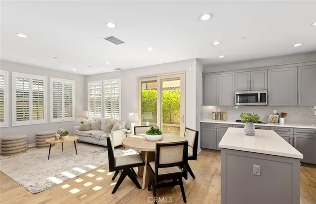 a dining room with furniture and window
