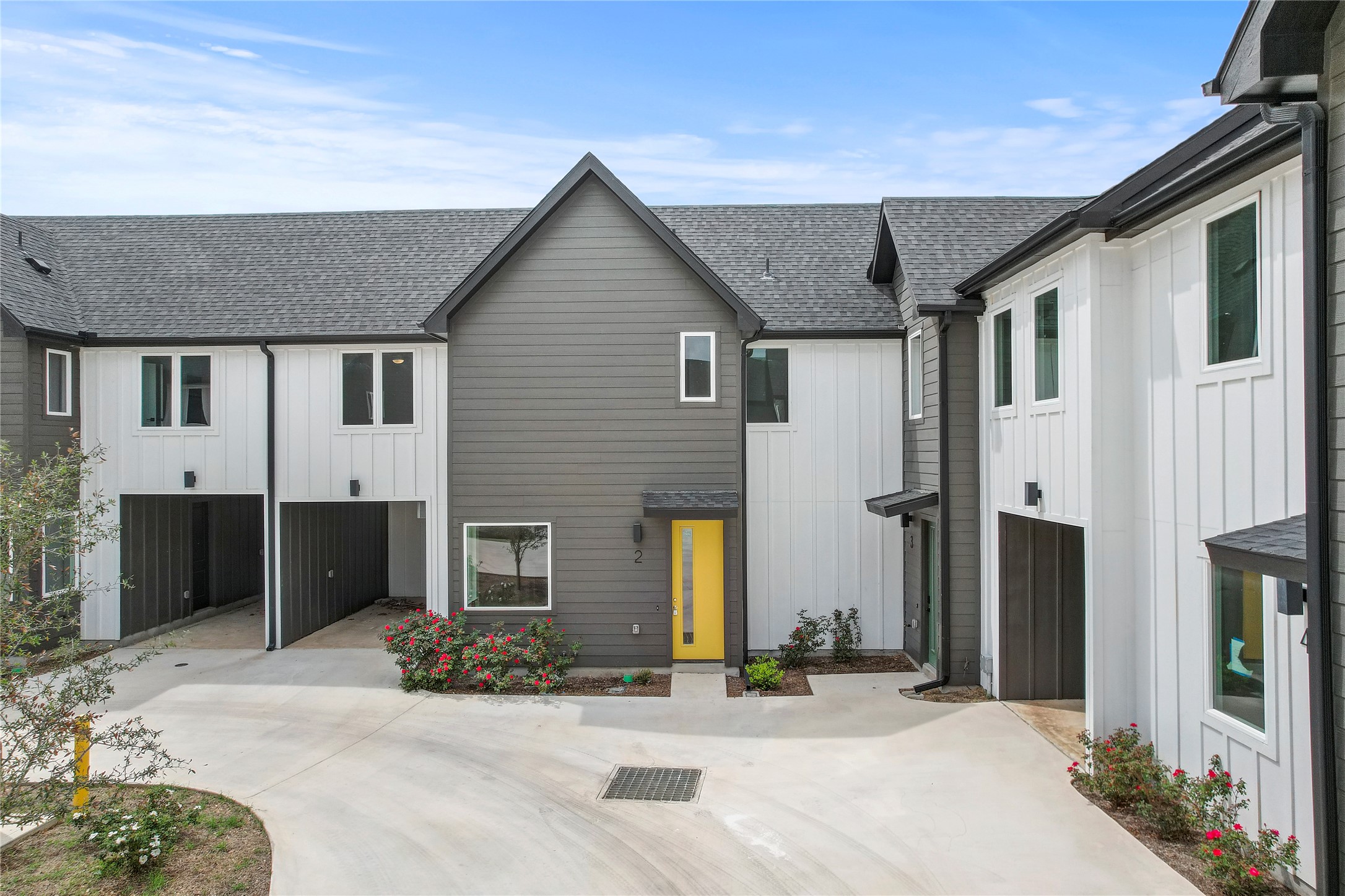 4127 East 12th Street, Unit 2 Austin, TX 78721 - Photo 5 of 28 Modern farmhouse featuring a shingled roof and board and batten siding