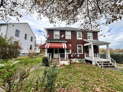 a front view of a building with garden