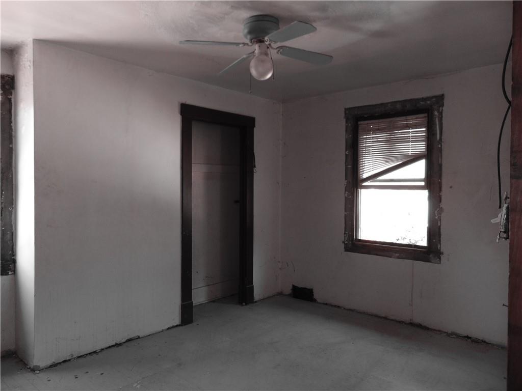 808 Wood Street Coraopolis, PA 15108 - Photo 7 of 11 an empty room with windows and fan