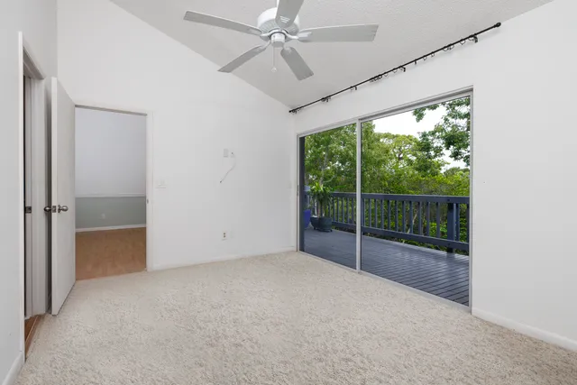 a view of an empty room with windows