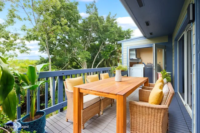 a view of a balcony with furniture