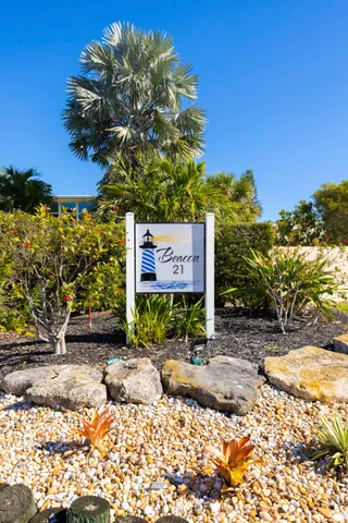 a sign that is sitting in front of a building