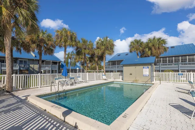 a view of a house with a yard porch and sitting area