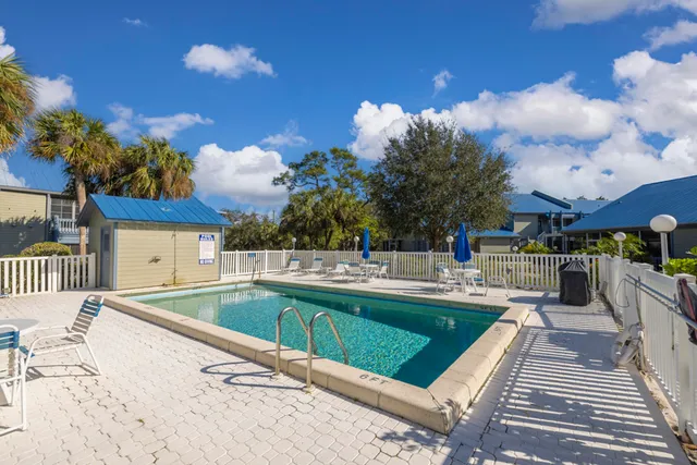 a view of a backyard with sitting area