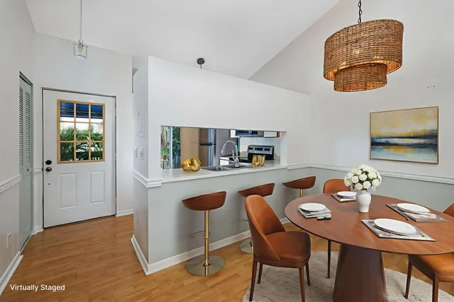 a dining room with furniture and window