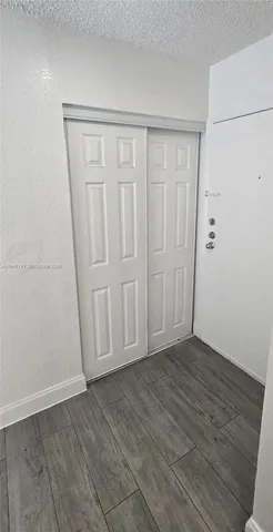 a view of entryway with wooden floor