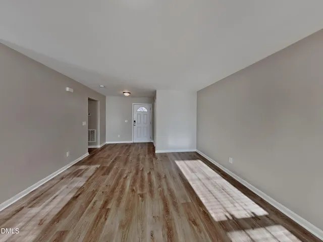 a view of wooden floor in an empty room