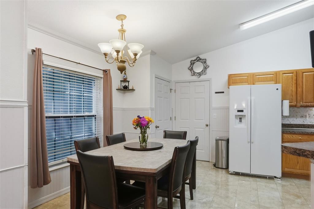 15396 Fleetwood Road Weeki Wachee, FL 34614 - Photo 13 of 66 a view of a dining room and a table a kitchen