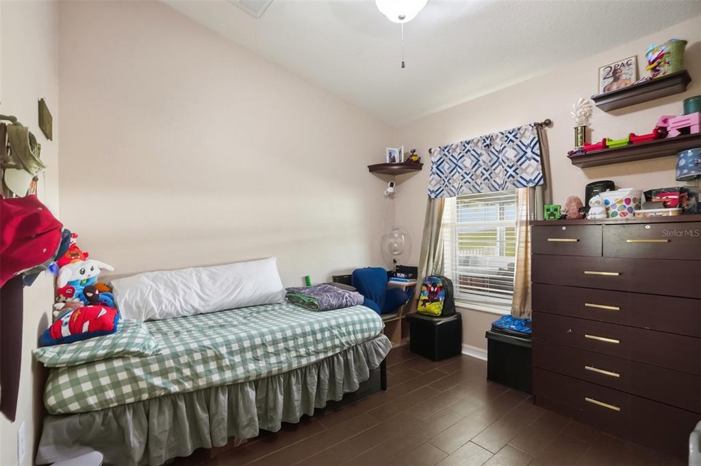 15396 Fleetwood Road Weeki Wachee, FL 34614 - Photo 18 of 66 a bedroom with a bed and a window