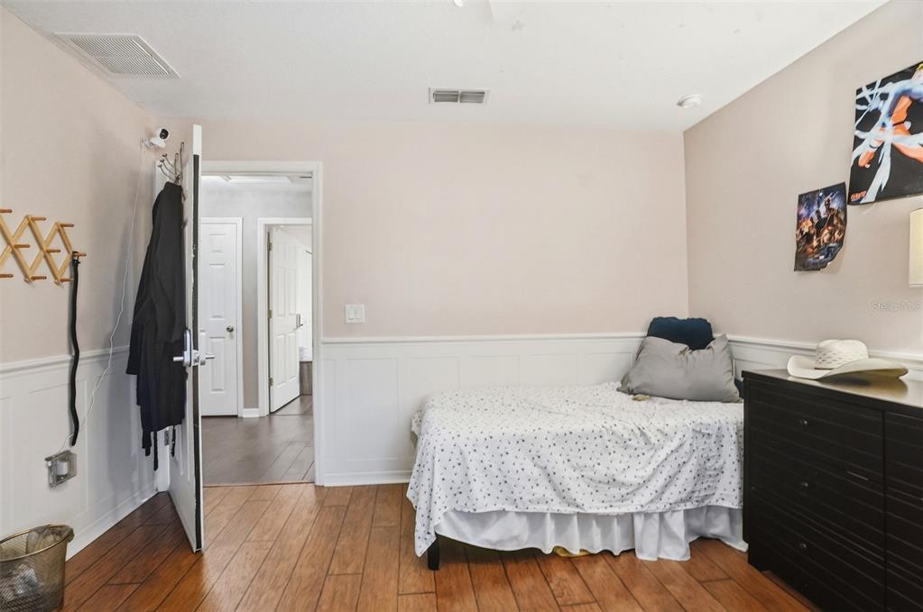 15396 Fleetwood Road Weeki Wachee, FL 34614 - Photo 21 of 66 a bedroom with a bed and a table