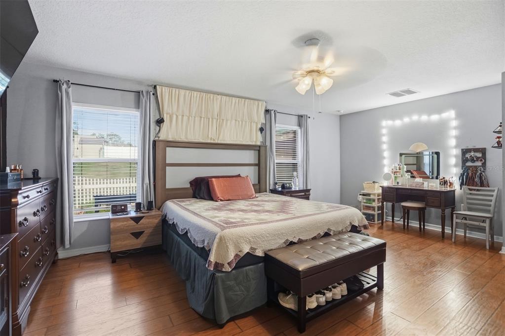 15396 Fleetwood Road Weeki Wachee, FL 34614 - Photo 28 of 66 a bedroom with a bed and a table