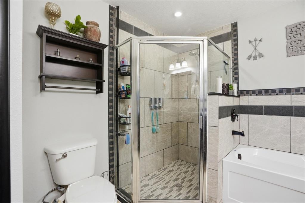 15396 Fleetwood Road Weeki Wachee, FL 34614 - Photo 31 of 66 a bathroom with a shower a toilet and a sink