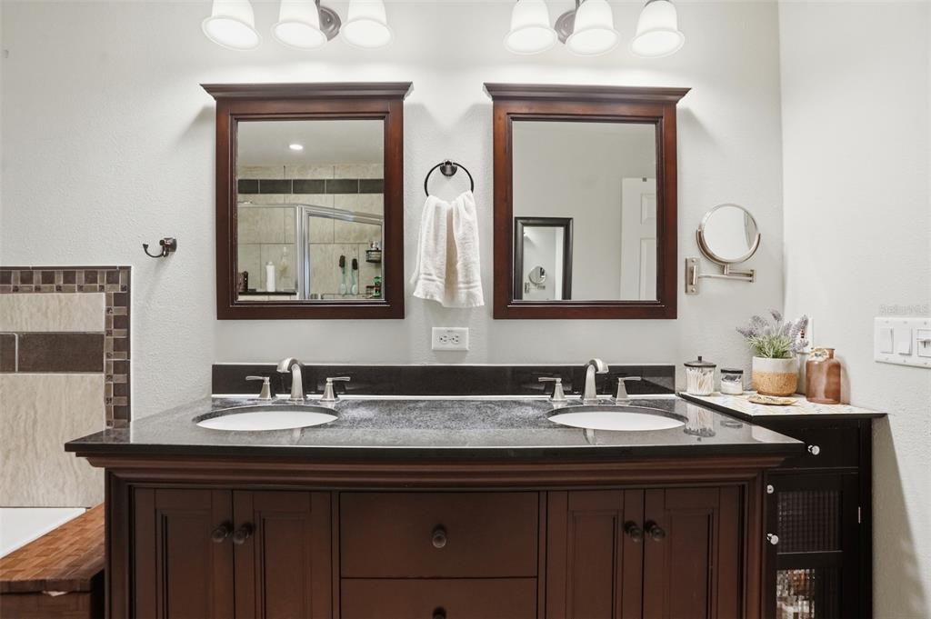 15396 Fleetwood Road Weeki Wachee, FL 34614 - Photo 33 of 66 a bathroom with mirror a sink and a mirror