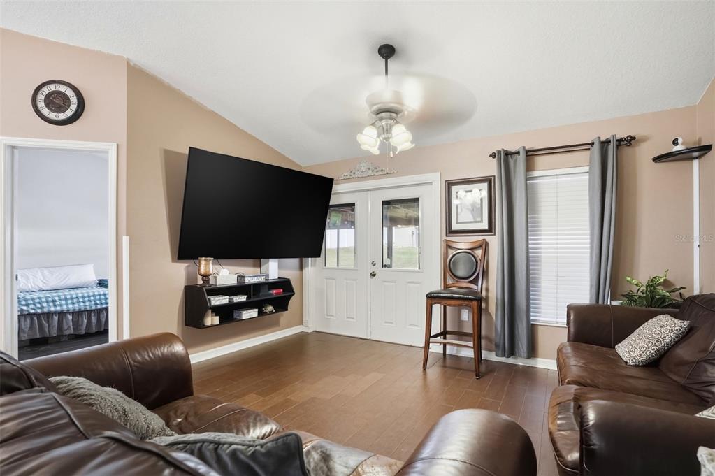 15396 Fleetwood Road Weeki Wachee, FL 34614 - Photo 4 of 66 a living room with furniture and a flat screen tv