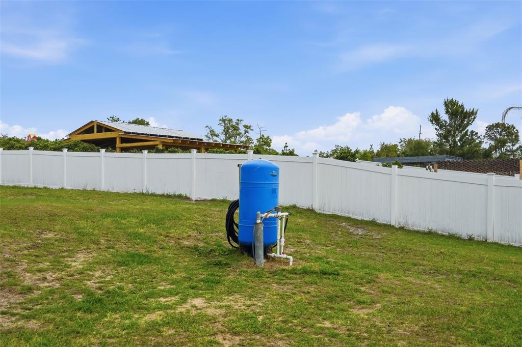 15396 Fleetwood Road Weeki Wachee, FL 34614 - Photo 46 of 66 a front view of a house with a garden and yard