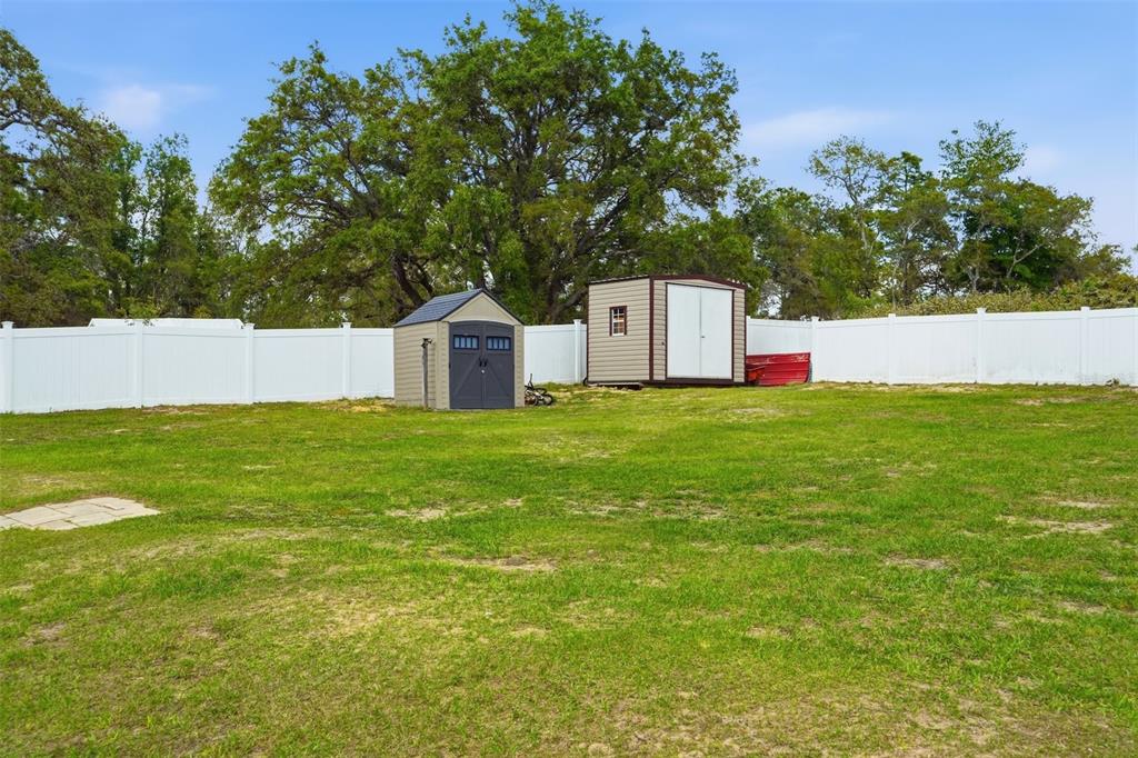 15396 Fleetwood Road Weeki Wachee, FL 34614 - Photo 47 of 66 a view of a house with a yard