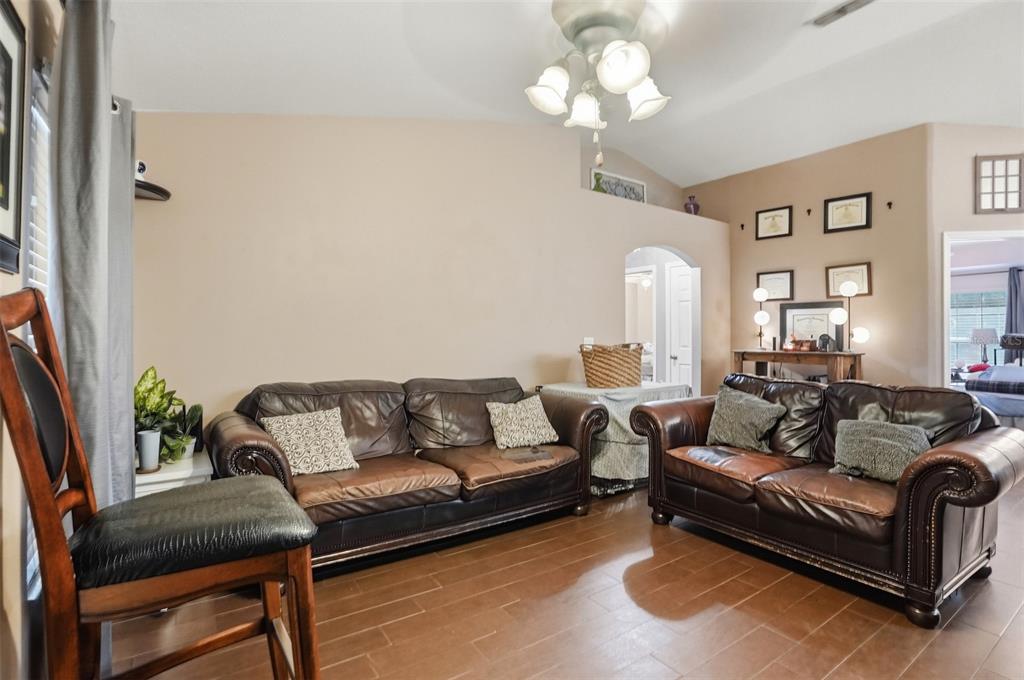 15396 Fleetwood Road Weeki Wachee, FL 34614 - Photo 5 of 66 a living room with furniture or chandelier and a couch