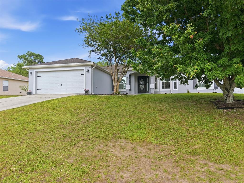 15396 Fleetwood Road Weeki Wachee, FL 34614 - Photo 52 of 66 a house that has a tree in front of it
