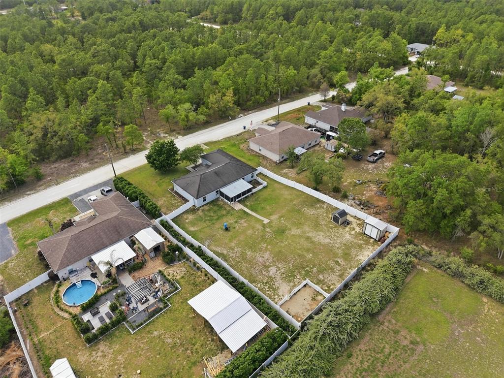 15396 Fleetwood Road Weeki Wachee, FL 34614 - Photo 59 of 66 swimming pool with couple of relaxing chair