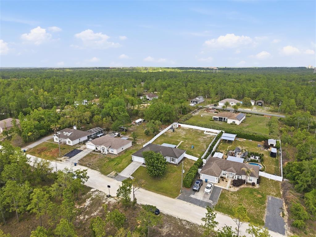 15396 Fleetwood Road Weeki Wachee, FL 34614 - Photo 62 of 66 an aerial view of residential houses with outdoor space