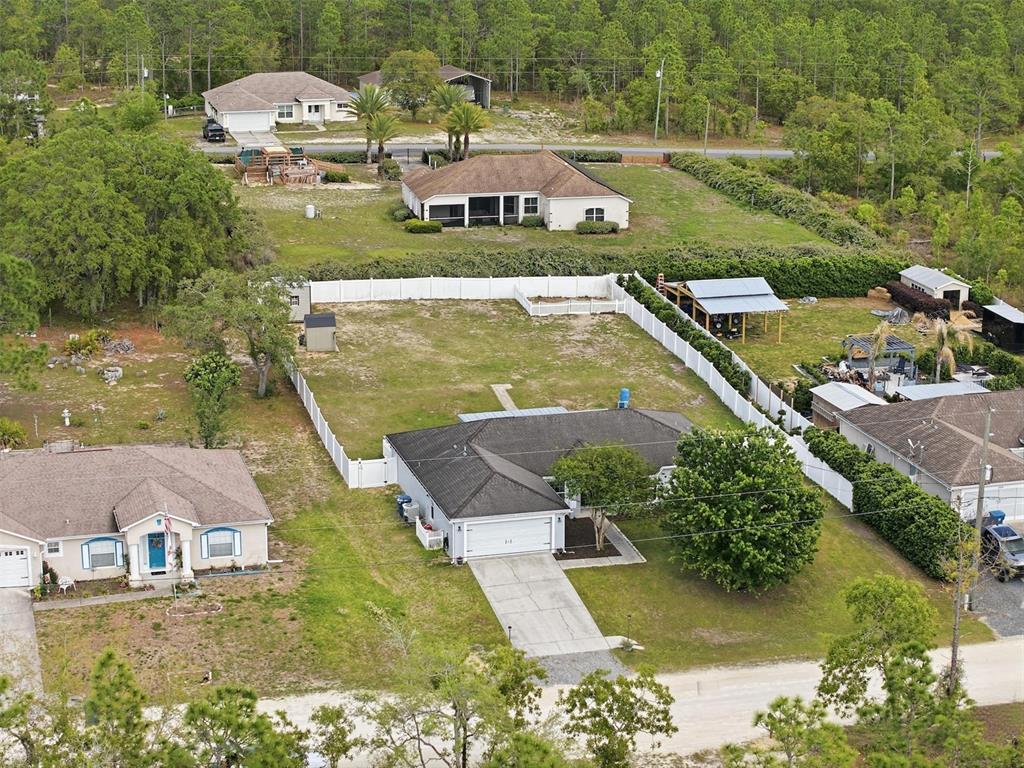 15396 Fleetwood Road Weeki Wachee, FL 34614 - Photo 63 of 66 a view of a lake with a yard and large trees