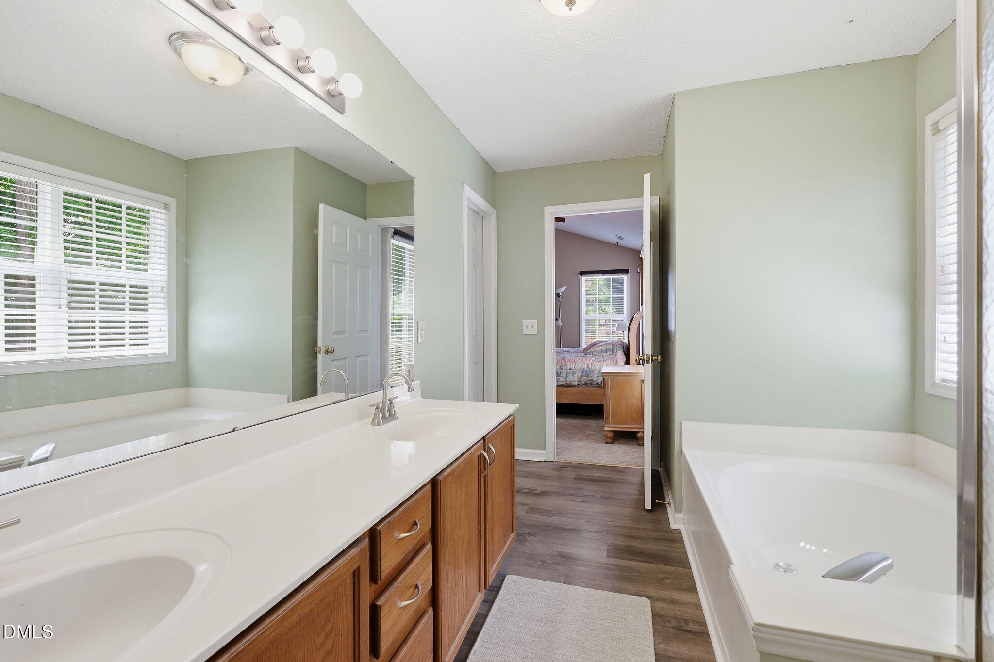 9105 Willow Valley Court Raleigh, NC 27617 - Photo 31 of 51 a spacious bathroom with a tub sink and mirror