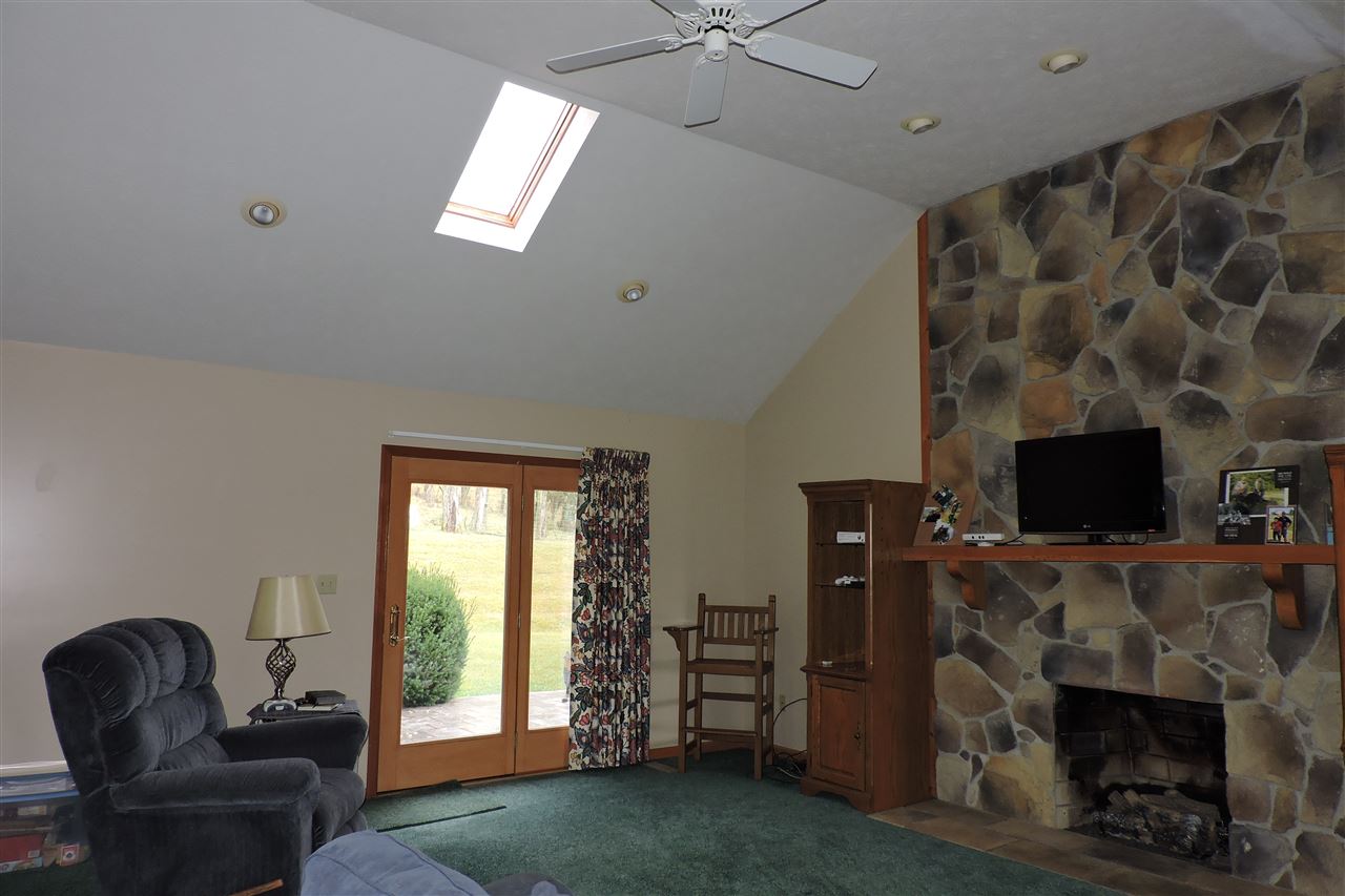 266 McKinley Road Middlebrook, VA 24459 - Photo 11 of 28 a living room with furniture a flat screen tv and a fireplace